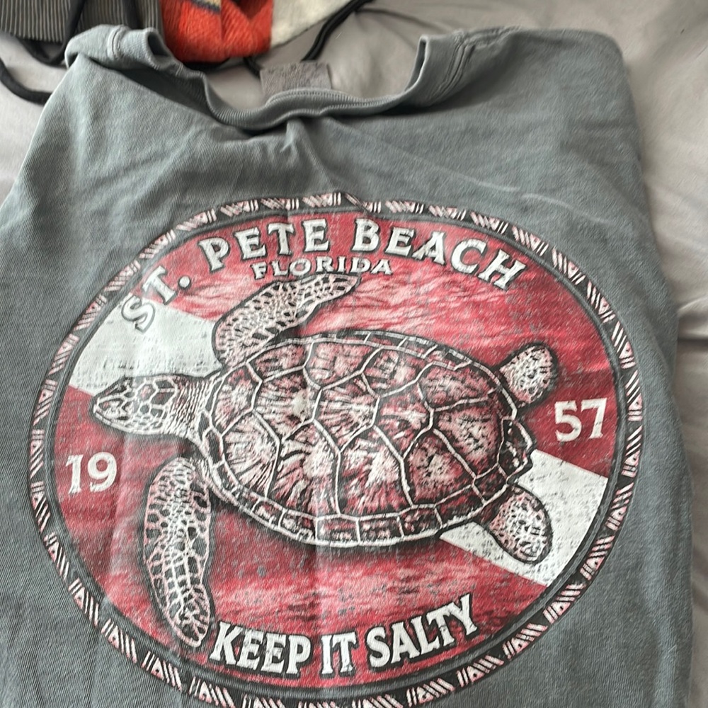 Play Long sleeve the brand is comfort colors, and it does have designs